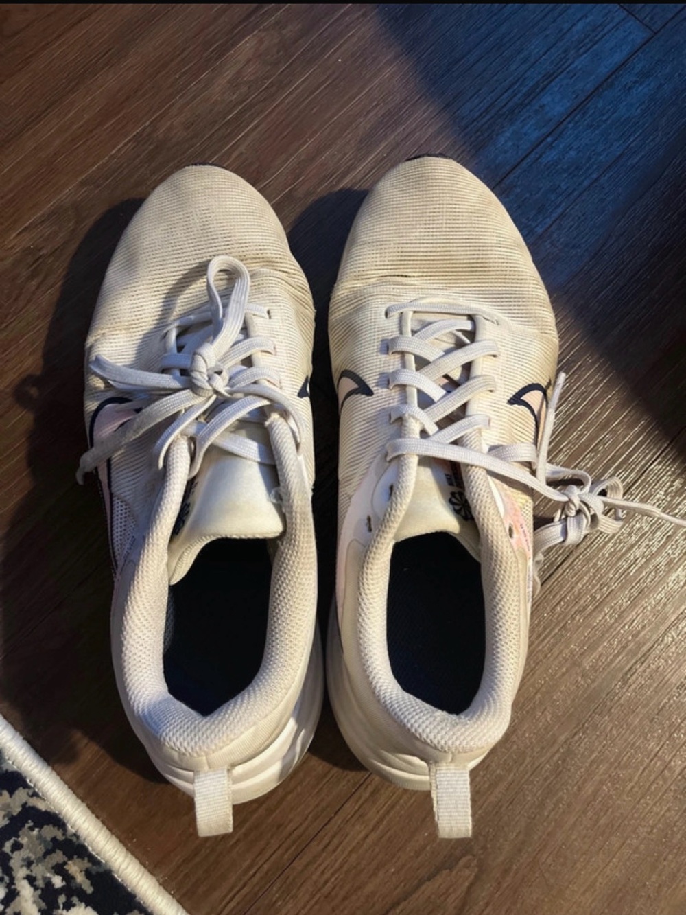 Nike Women's Athletic Shoes in Off-White with Black Swoosh